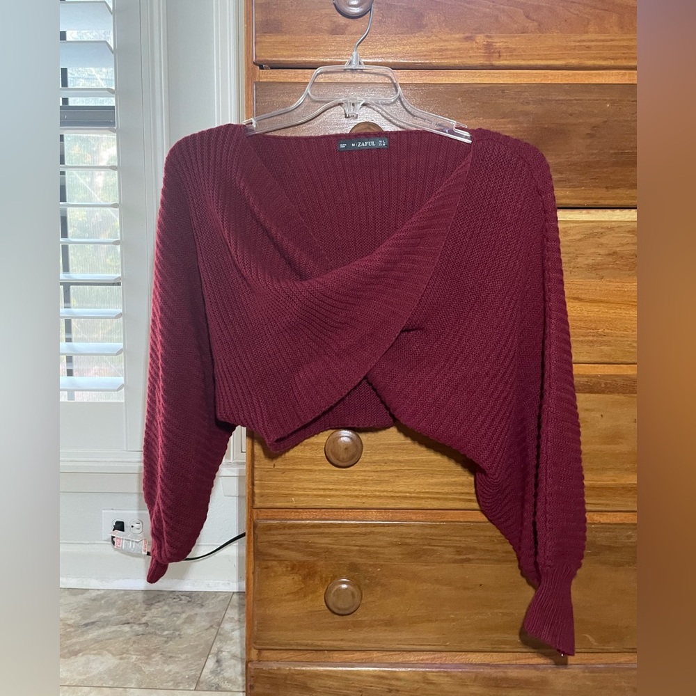 Front twist red sweater. Comfortable material, not itchy.